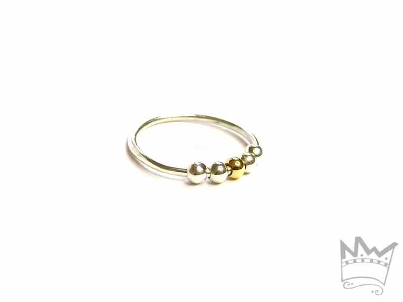 Fidget Ring mit einer Goldkugel